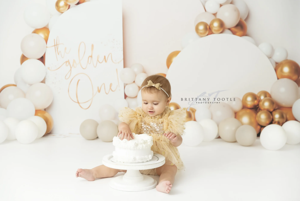 white and gold backdrop for utah county cake smash photographer